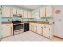 Classic kitchen with ample cabinet space and modern appliances, including a stainless steel oven at 3035 Victory Palms Dr, Edgewater, FL 32141