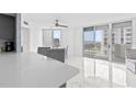 Bright living room showcasing sleek marble floors, modern gray furniture, and stunning ocean views at 3047 S Atlantic Ave # 1805, Daytona Beach, FL 32118