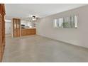 Bright and airy living room with tile floors and a view of the modern, remodeled kitchen at 600 N Boundary Ave # 110A, Deland, FL 32720