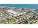 Aerial view of the condo in the landscape of buildings and ocean views at 10 Lynnhurst Dr # 1050, Ormond Beach, FL 32176