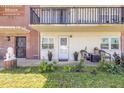 Unit 105 entrance with a cute seating area and manicured lawn at 10 Lynnhurst Dr # 1050, Ormond Beach, FL 32176