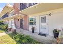 Close-up of condo entrance, potted flowers, and Lion statue flanking the entry at 10 Lynnhurst Dr # 1050, Ormond Beach, FL 32176