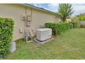Backyard view showing an emergency Generac power generator, ensuring comfort and safety during unexpected power outages at 1310 Pup Fish Ln, Deland, FL 32724