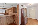 Inviting entryway with a wood accent bar, and a vintage china cabinet at 1411 N Beach St, Ormond Beach, FL 32174