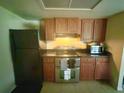 Efficient kitchen with stainless steel appliances and ample cabinet space, perfect for culinary enthusiasts at 1556 Ferendina Dr, Deltona, FL 32725