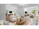 Bright and airy living room with neutral decor and comfortable seating, perfect for relaxing and entertaining guests at 1683 10Th Ave, Deland, FL 32724