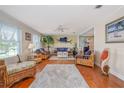 Bright living room with hardwood floors, ceiling fan, and comfortable seating, perfect for relaxation and entertaining at 179 Ann Rustin S Dr, Ormond Beach, FL 32176