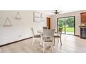 Cozy dining area featuring a contemporary table set and laminate flooring at 2127 3Rd Ave, Deland, FL 32724