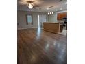 Inviting living room offering a seamless flow to the kitchen and dining areas, perfect for entertaining at 223 W Fiesta Key Loop, Deland, FL 32720