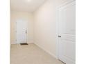 Bright foyer featuring tile flooring, neutral walls, and convenient access to other parts of the house at 2241 Litchfield Loop, Deland, FL 32720