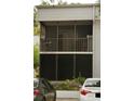 Condo building featuring a screened balcony, providing a relaxing outdoor space at 2565 Oak Park Way # 213, Orlando, FL 32822