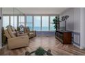 Cozy living room featuring ocean views, comfortable seating, and stylish decor at 2800 N Atlantic Ave # 1716, Daytona Beach, FL 32118