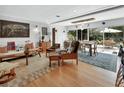 Inviting living room featuring stylish mid-century modern furniture and sliding doors to the patio at 319 N Salisbury Ave, Deland, FL 32720