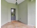 Inviting entryway with a decorative door and warm, welcoming ambiance at 3671 Plantation Dr, Ormond Beach, FL 32174