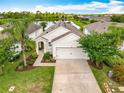 Well-maintained home with a two-car garage, landscaping, and beautiful lake view at 422 Armoyan Way, New Smyrna Beach, FL 32168