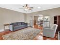 Bright living room features hardwood floors, neutral walls, and an open concept design at 441 N Julia Ave, Deland, FL 32720
