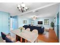 Bright living room featuring stylish furniture, hardwood floors, and ample natural light at 507 Sand Ave, Apopka, FL 32703