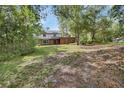 Two-story home surrounded by lush greenery in a serene setting at 658 Westchester Dr, Deland, FL 32724