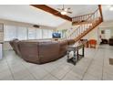 Inviting living area featuring a staircase, vaulted ceilings, and plenty of natural light at 910 Braddock Rd, Enterprise, FL 32725