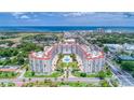 Beautiful aerial shot of condo complex near the ocean, showcasing its red-tile roofs and lush surroundings at 1 John Anderson Dr # 3170, Ormond Beach, FL 32176