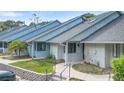 Inviting one-story home has well-kept lawn, decorative stone retaining wall, and convenient covered entrance at 101 N Hill Ave # 6, Deland, FL 32724