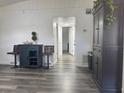 Elegant entryway with hardwood floors and stylish furnishings, offering a warm welcome at 1215 N Boston Ave, Deland, FL 32724
