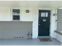 Welcoming front entrance featuring a decorative door, turtle and flamingo decor, and a welcome mat at 1215 N Boston Ave, Deland, FL 32724