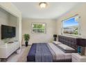 This bedroom boasts natural light, neutral walls and modern decor at 1612 W Grant St, Orlando, FL 32805