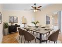 Elegant dining room with a modern table, stylish chairs, and access to the outdoor patio at 2263 Catbriar Way, Oviedo, FL 32765
