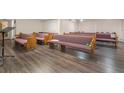 Spacious auditorium with multiple rows of wooden pews on wood floors at 2620 Doyle Rd, Deltona, FL 32738