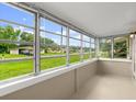 Enclosed sunroom provides ample natural light and views of the outdoors at 2633 Yale Rd, South Daytona, FL 32119