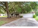 Lovely single-story house featuring a well-maintained lawn, covered porch, and an attached garage at 270 Sandyhook Ln, Deland, FL 32724