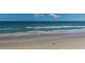 Scenic beach view showcasing sandy shores, rolling waves, and a serene ocean horizon at 3003 S Atlantic Ave # 3A2, Daytona Beach Shores, FL 32118