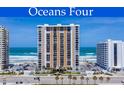 Oceans Four condo building featuring well maintained landscaping, and convenient parking at 3003 S Atlantic Ave # 3A2, Daytona Beach Shores, FL 32118
