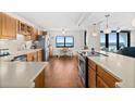 Spacious kitchen features wood cabinets, stainless steel appliances, and ocean views at 3003 S Atlantic Ave # 3A2, Daytona Beach Shores, FL 32118