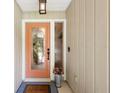 Charming front door with decorative glass and a welcoming entrance mat at 505 Black Ironwood Dr, Deland, FL 32724