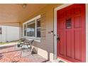 Inviting front porch featuring tiled flooring, number '505', and a red front door at 505 Wisteria Rd, Daytona Beach, FL 32118