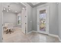 Inviting home office with ample natural light, stylish lighting, and a comfortable workspace at 141 Mosaic Blvd, Daytona Beach, FL 32124