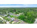 Aerial view of a charming neighborhood showcasing lush greenery and well-maintained homes at 1725 12Th St, Orange City, FL 32763