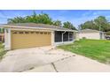 Charming single-story home featuring an attached garage and partially screened porch in a quiet neighborhood at 1725 12Th St, Orange City, FL 32763