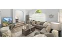 Inviting living room with plush seating, wood floors, and decorative touches offering comfort and style at 2163 Fireside Rd, Deltona, FL 32738
