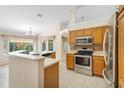 Open kitchen with stainless steel appliances and ample counter space at 2478 Unionville Dr, Deltona, FL 32725