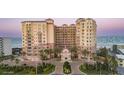 A stunning beach-front condo features elegant Mediterranean architecture, lush landscaping, and breathtaking ocean views at 2515 S Atlantic Ave # 203, Daytona Beach, FL 32118