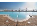 Inviting pool with clear blue water and lounge seating for relaxing by the water at 2515 S Atlantic Ave # 203, Daytona Beach, FL 32118