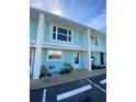 Exterior view of the updated and painted condo unit with a white frame and a blue painted surface at 4786 S Atlantic Ave # 3, Ponce Inlet, FL 32127