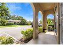Exterior view from the front porch, highlighting neighborhood street and greenery at 511 Polaris Loop # 105, Casselberry, FL 32707