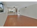 Open living space with wood floors and view of the kitchen area at 600 N Boundary Ave # 420, Deland, FL 32720