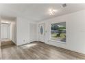 Light and bright foyer with tile flooring and front door at 916 Kathy St, Daytona Beach, FL 32114