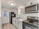 Updated kitchen featuring stainless steel microwave and black range at 916 Kathy St, Daytona Beach, FL 32114