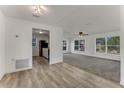 Open concept living room and updated kitchen with new carpet at 916 Kathy St, Daytona Beach, FL 32114